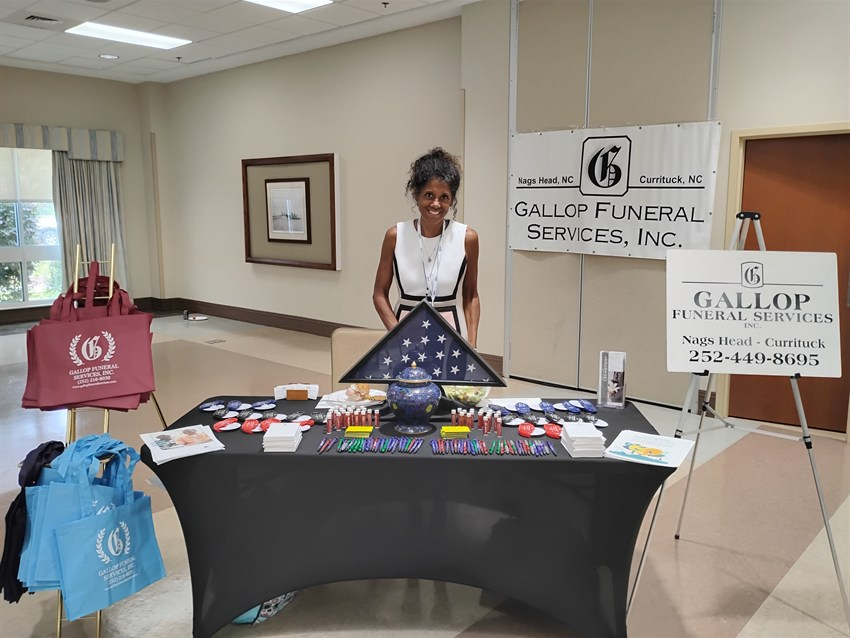 The Gallop Funeral Services vendor table at the Currituck Chamber of Commerce Tech Summit in Barco